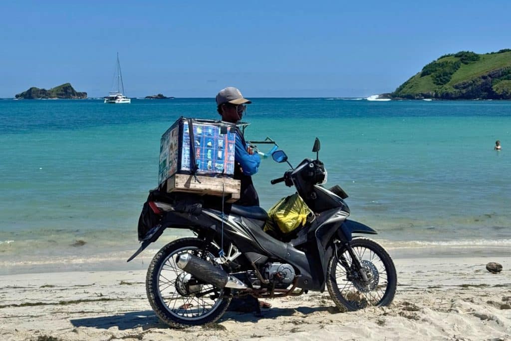 Scooter parked on a sandy beach in Lombok