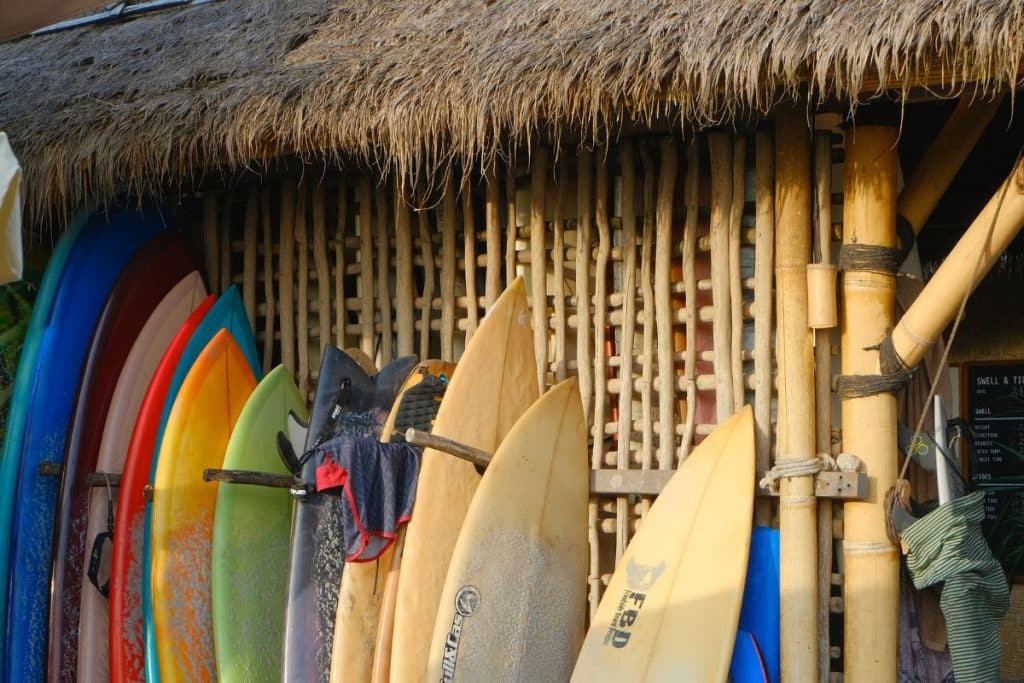 Surfboard resting outside Times Warung café