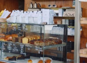 Pastries and coffee served at Acme café in Canggu, Bali