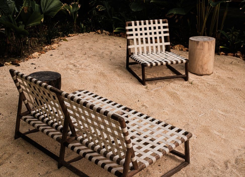 Outdoor sofas on sand at Ronja Boutique Hotel Uluwatu in a relaxed boutique setting