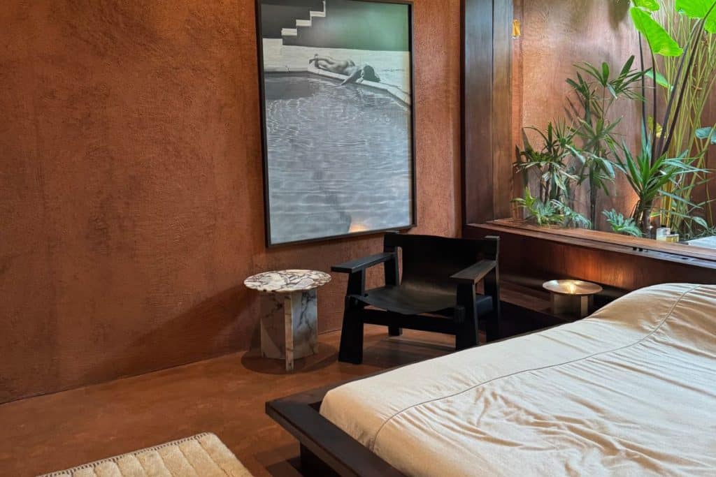 Further Hotel room with minimalist terracotta tones and modern lines