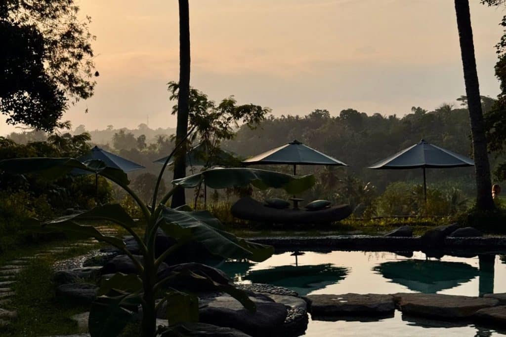 Sunset over the jungle from Bambu Indah boutique hotel in Ubud