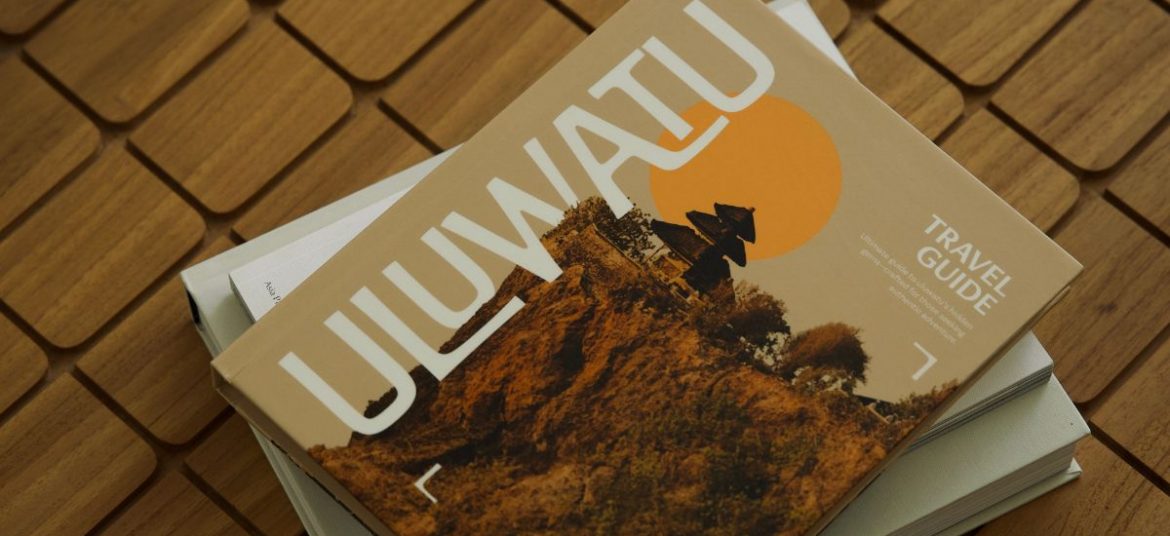 Close-up of the Uluwatu Travel Guide on a wooden table