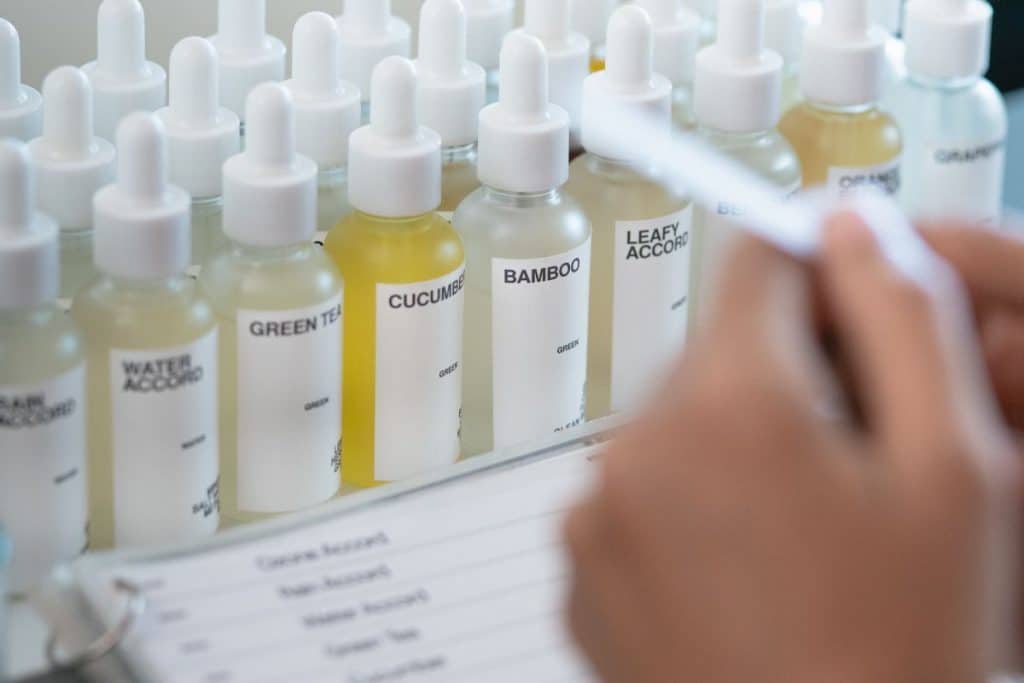 Participant creating custom perfume during a fragrance workshop in Bali