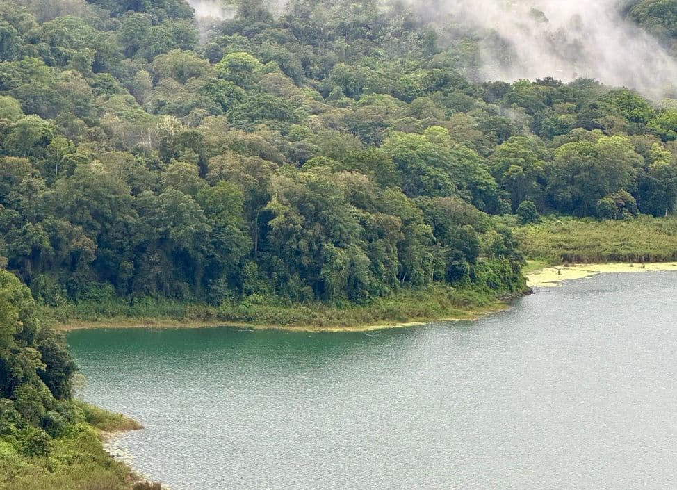 Scenic landscape view of Lake Beratan and surrounding hills in Bedugul