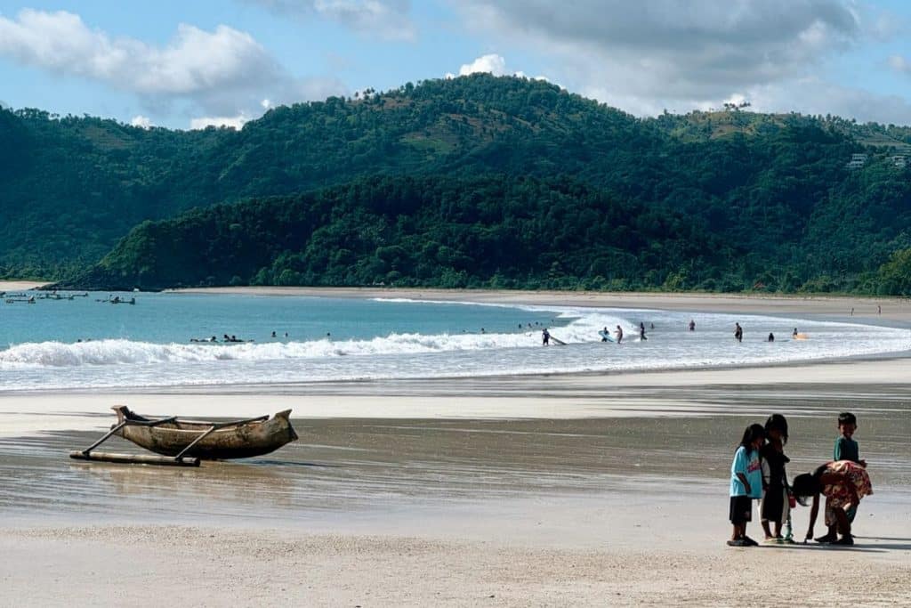 White sand beach with turquoise water at Tanjung Aan in South Lombok.