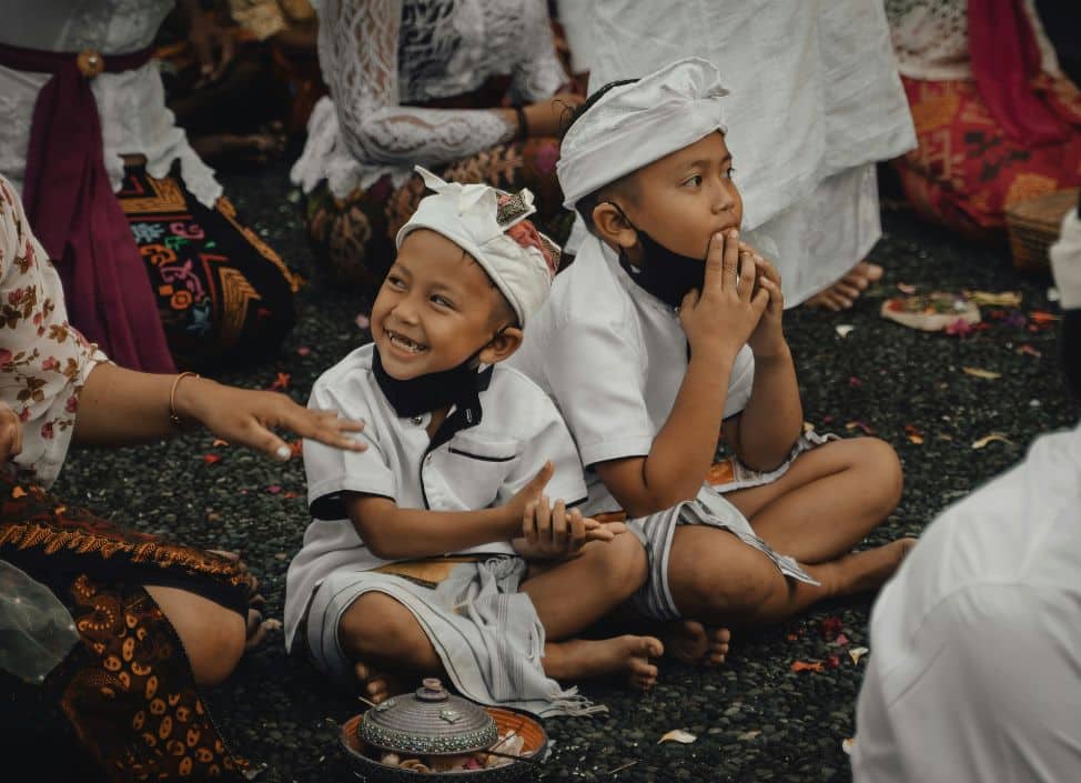 Two young children taking part in a Balinese ceremony