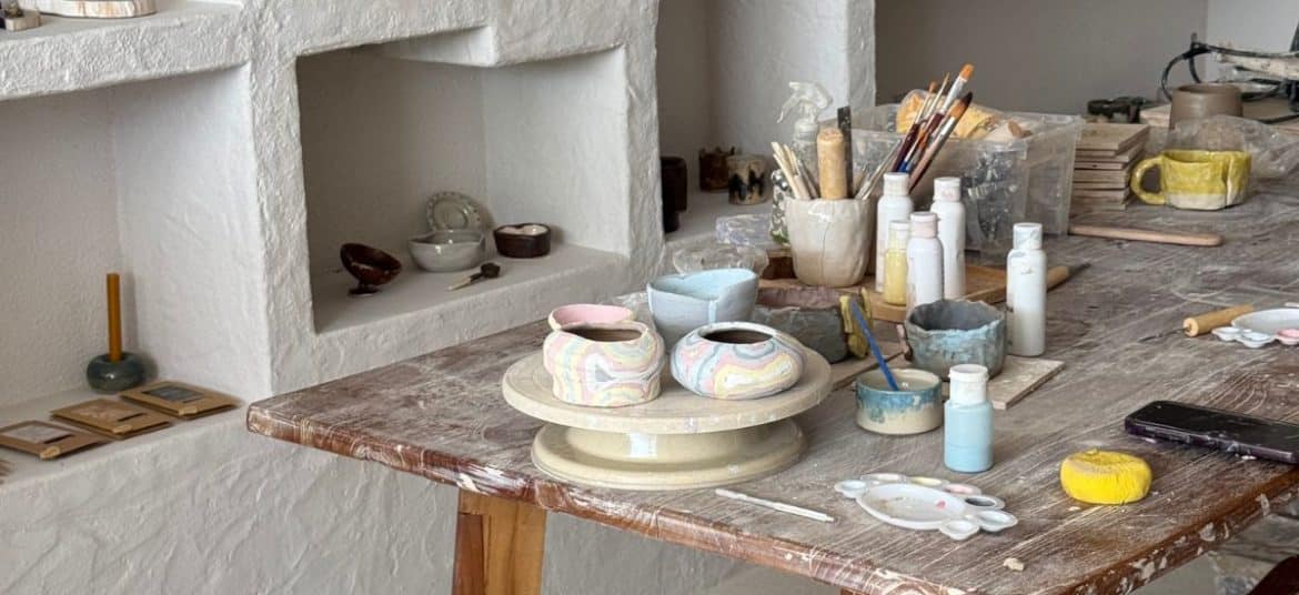 wooden table showcasing handmade ceramics