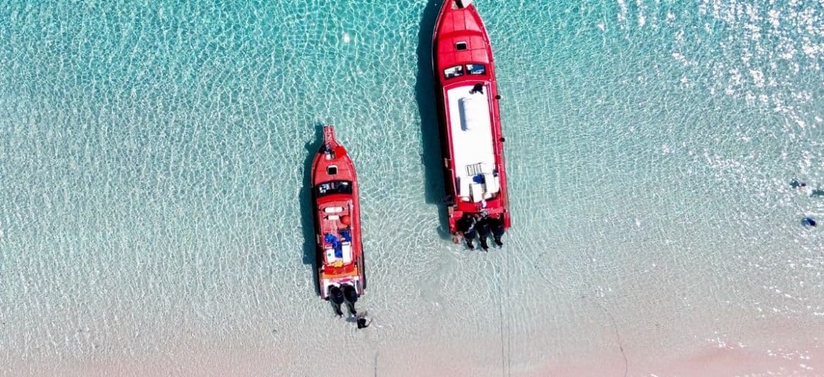 Soft pink sand blending with turquoise water at Pink Beach, Komodo National Park.