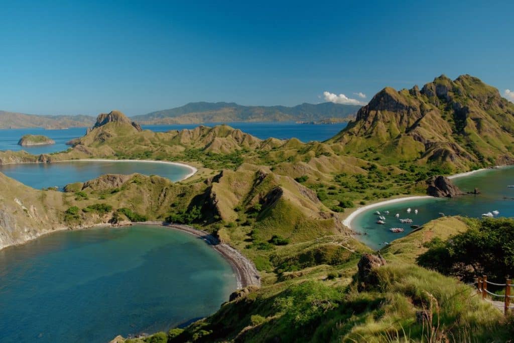 Padar Island viewpoint at sunrise, Komodo National Park Indonesia with panoramic hills and turquoise bays