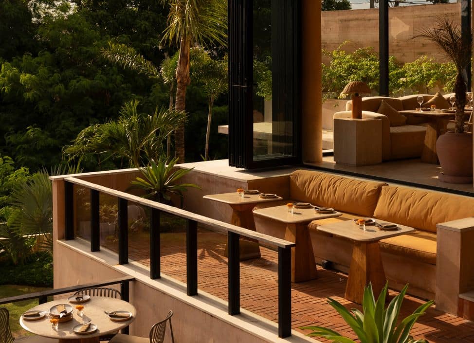 Elegant dining area at Teja Restaurant in Ubud surrounded by tropical greenery