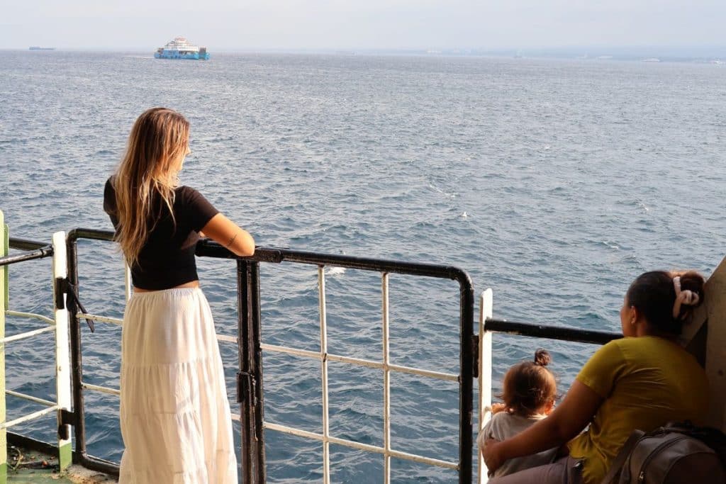 View from the ferry crossing from Bali to Java with travelers and motorbikes
