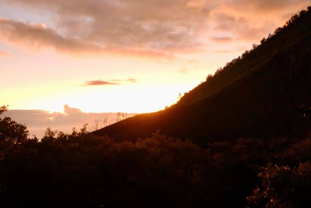Sunrise at Mount Ijen volcano with early morning colors over the mountains, Java, Indonesia
