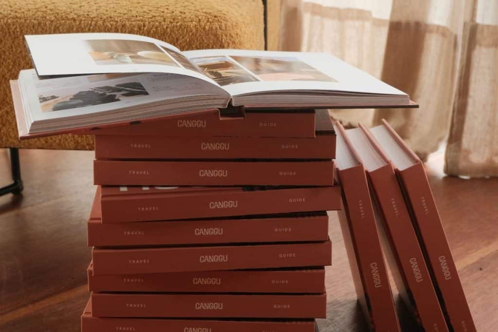 Stack of Canggu & Seminyak Travel Guides on a table
