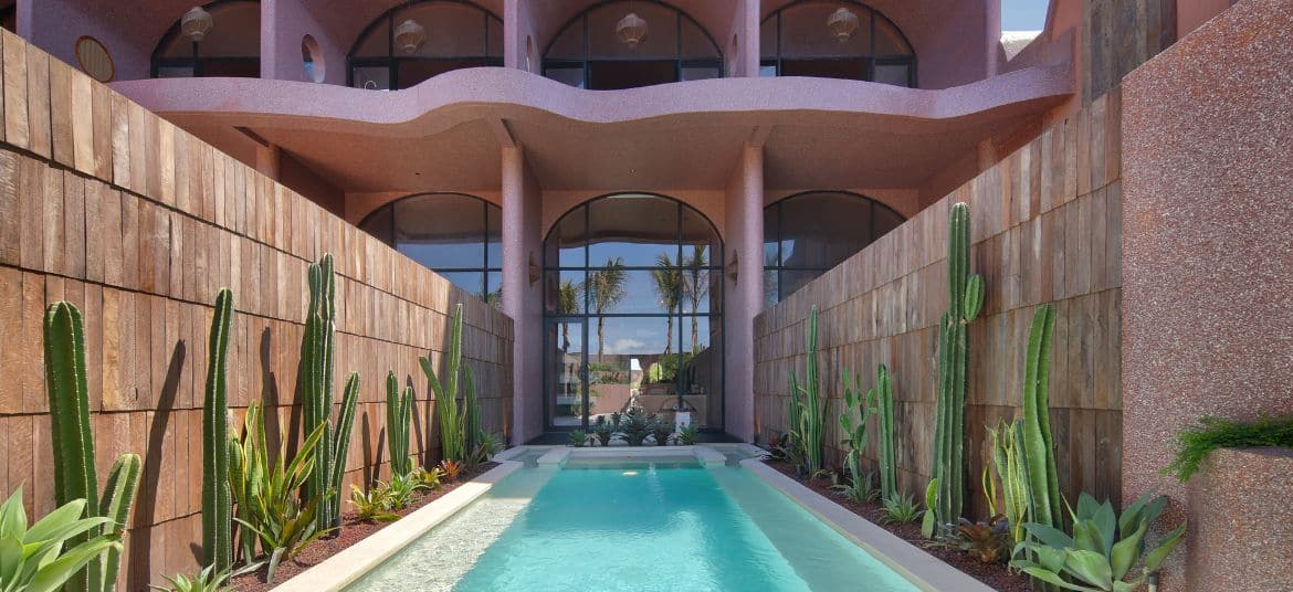 Exterior façade of Seascape Resort & Spa Sanur with modern architecture and tropical greenery.