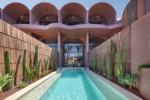 Exterior façade of Seascape Resort & Spa Sanur with modern architecture and tropical greenery.