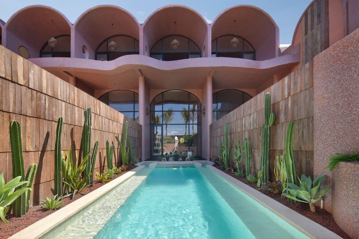 Exterior façade of Seascape Resort & Spa Sanur with modern architecture and tropical greenery.