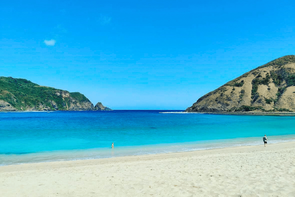 Mawun Beach Lombok nestled between two headlands with calm blue water
