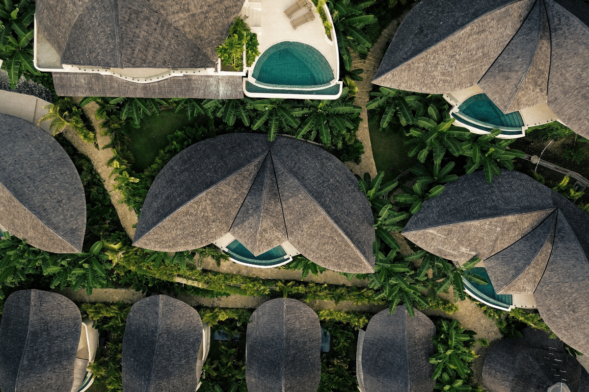 Drone view of Mambo Lombok bamboo villas surrounded by jungle in Kuta Lombok