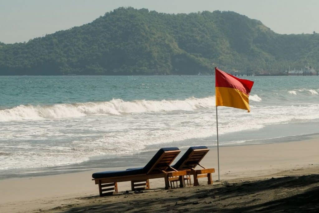 Amankila Bali black sand beach with clear water