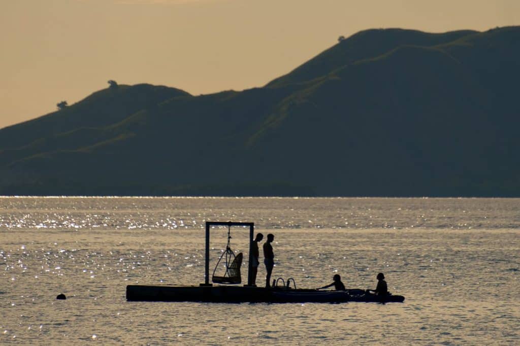 Snorkeling and kayaking in the clear waters of Menjaga Bay