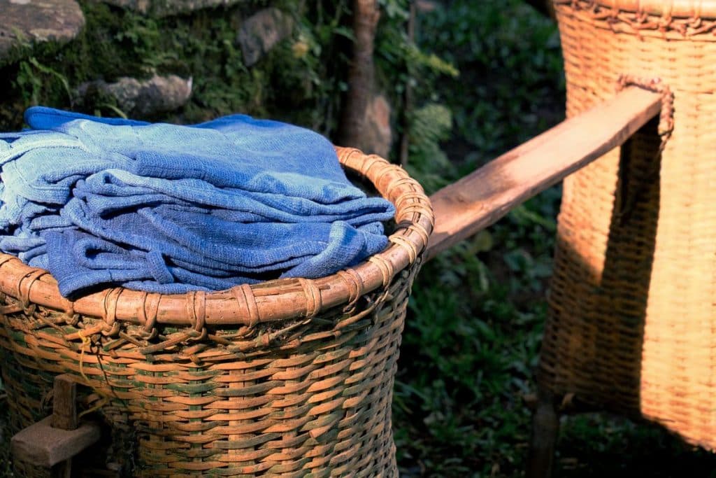 Basket filled with indigo-dyed fabrics at Tian Taru