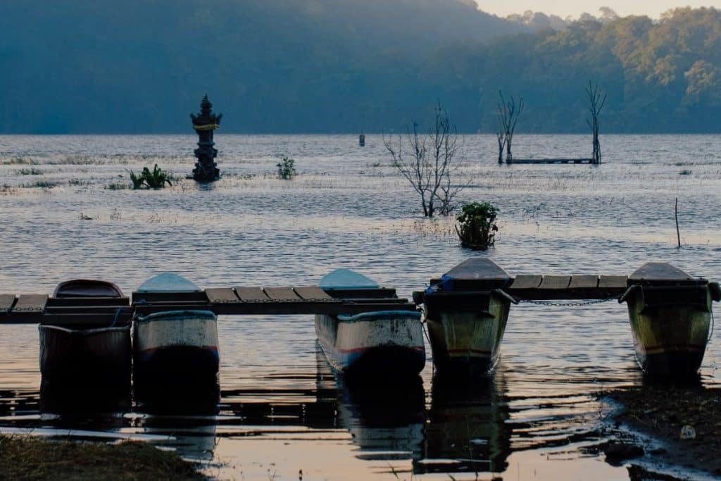 Traditional boat floating on Lake Beratan in Bedugul, Bali