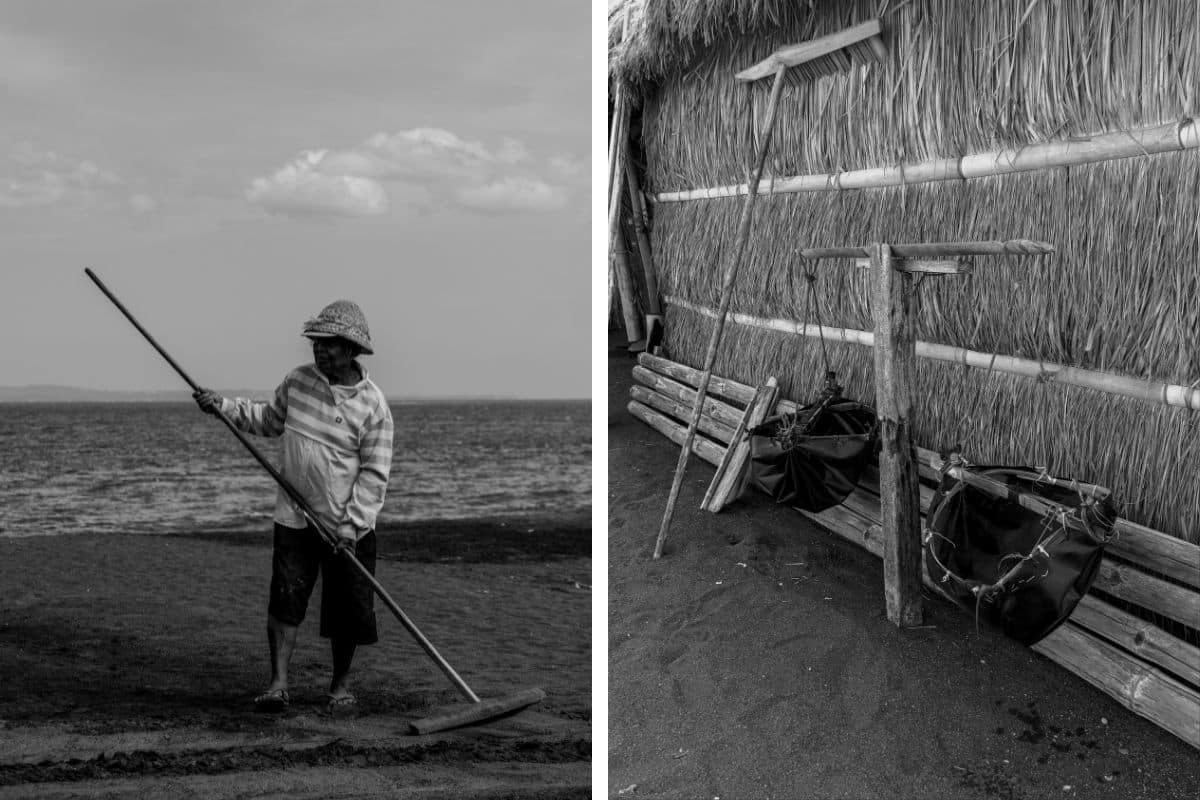 Balinese salt farmer raking volcanic sand during salt production