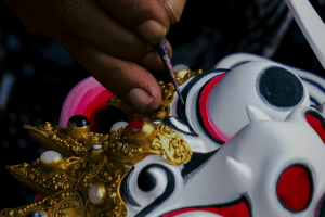 Traditional unfinished Balinese wood carving masks inside Anom’s workshop in Mas Village, Bali