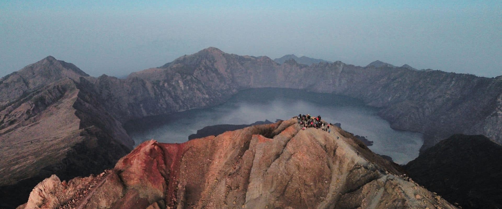 Mount Rinjani volcano and crater lake seen from above in Lombok