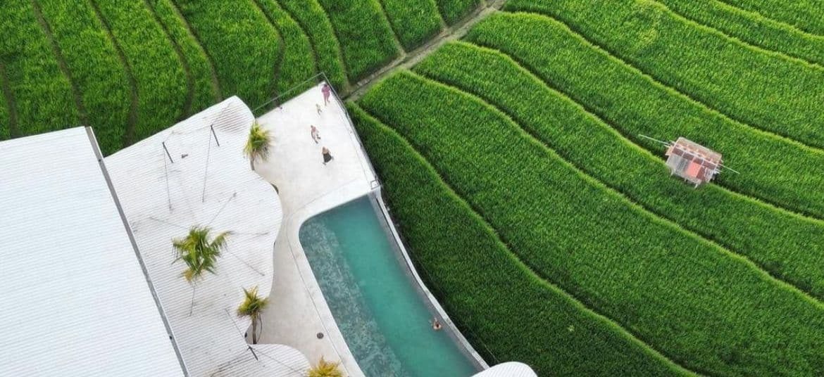 Drone view of Bali Padel Academy surrounded by rice fields in Canggu, Bali