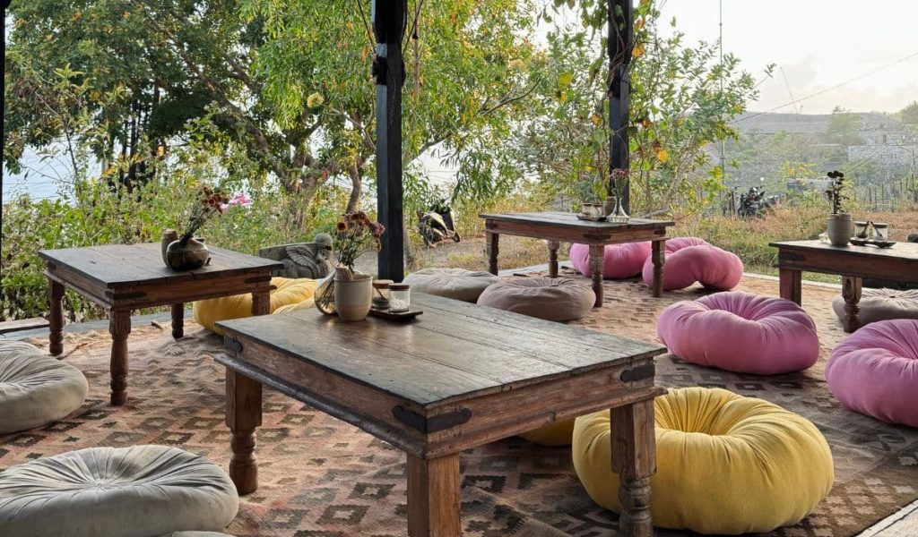 Outdoor terrace with plants and rustic table