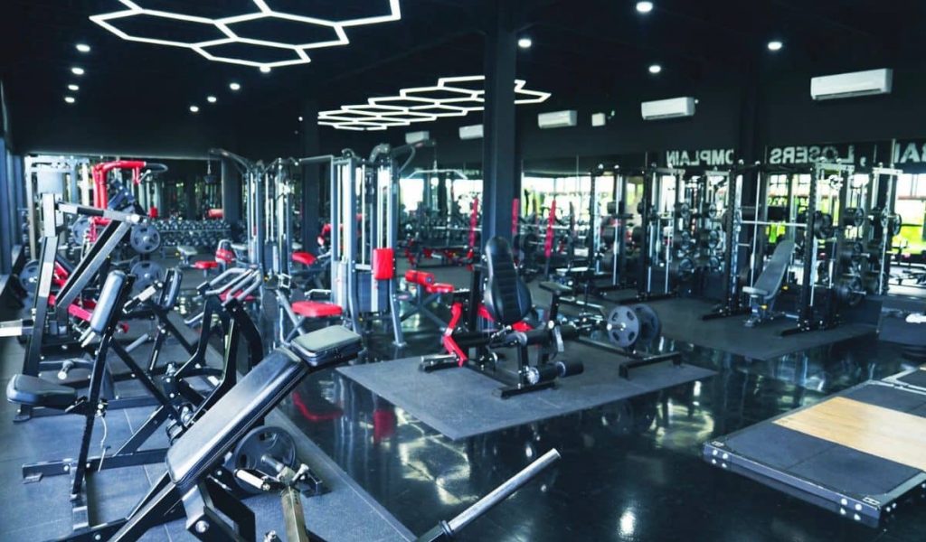 Obsidian gym modern workout area with weights and machines