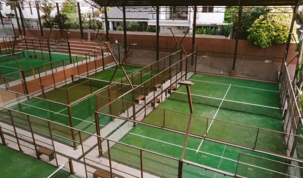 Padel court at Bali Social Club with players in action