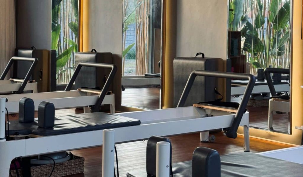 Reform Pilates studio interior with reformer machines