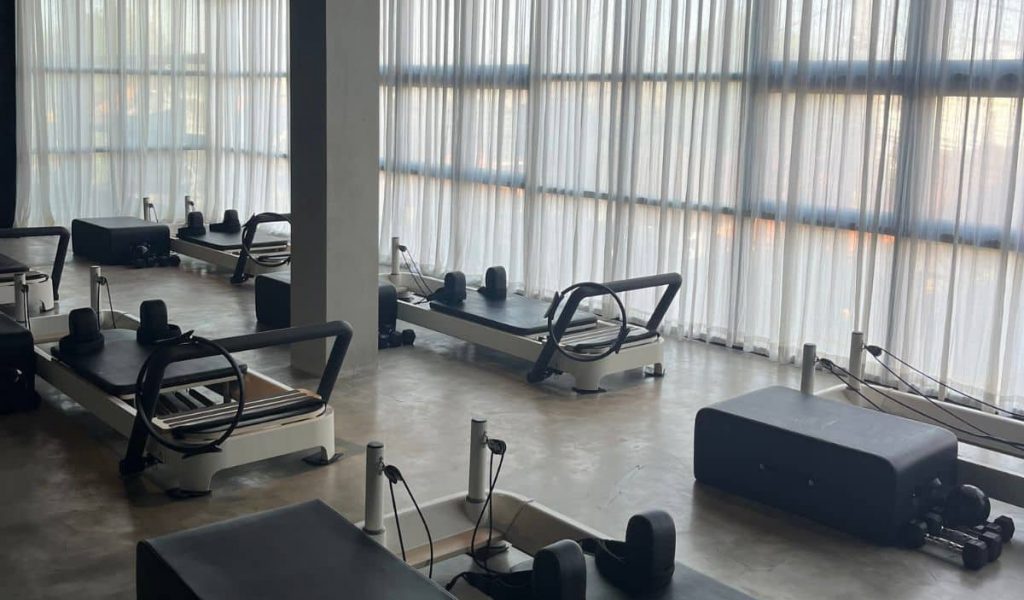 Reformer machines inside The Project Pilates studio