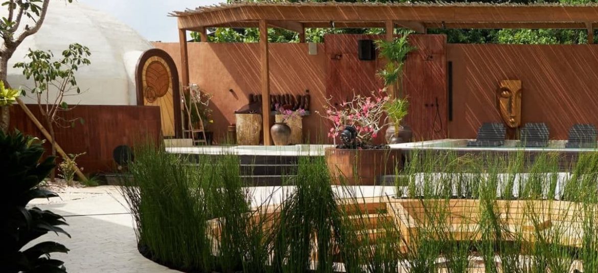 Terracotta-colored wellness hub Atmos in Uluwatu with cold plunge and seating area