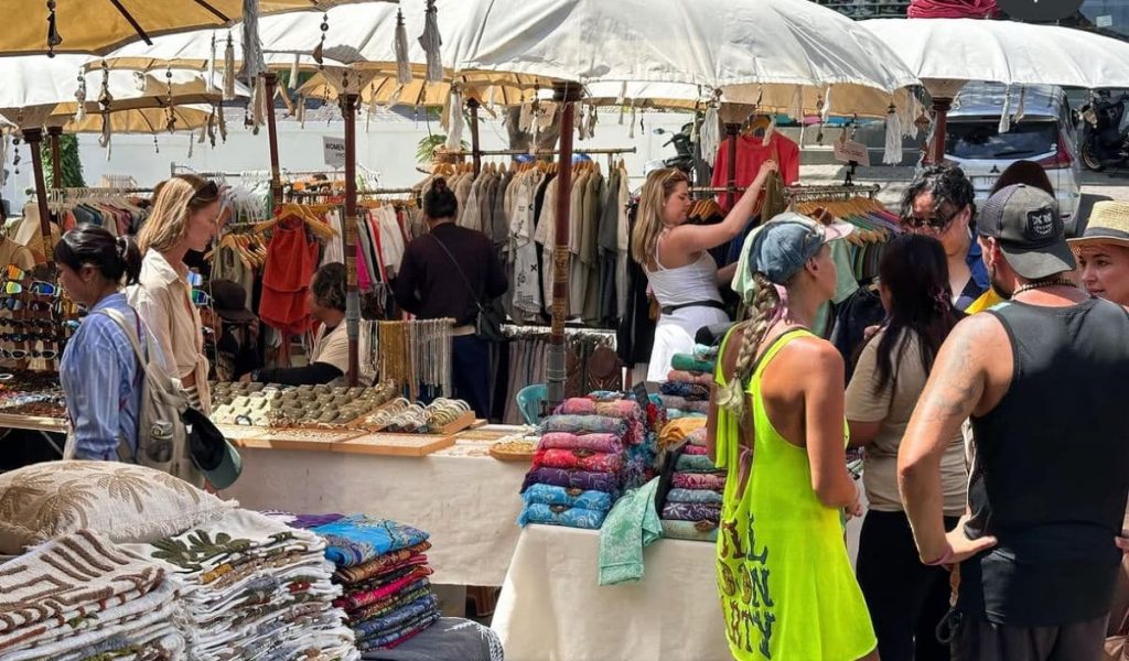 Artisan stalls featuring handmade jewelry and local products at Warung Cenana Market