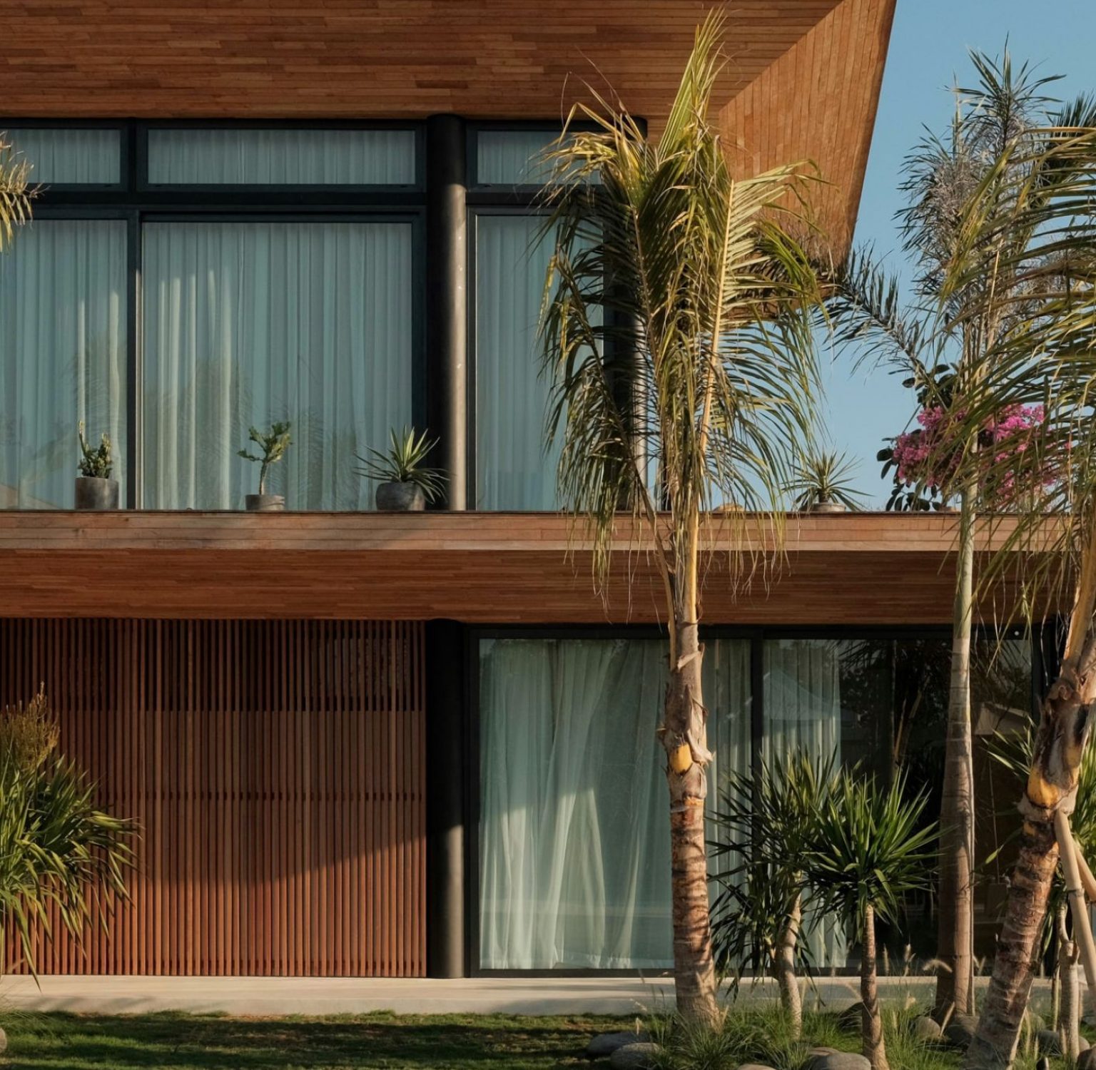 Flatlay of the Stay In Bali travel guide with coffee and tropical elements, evoking a curated travel experience.