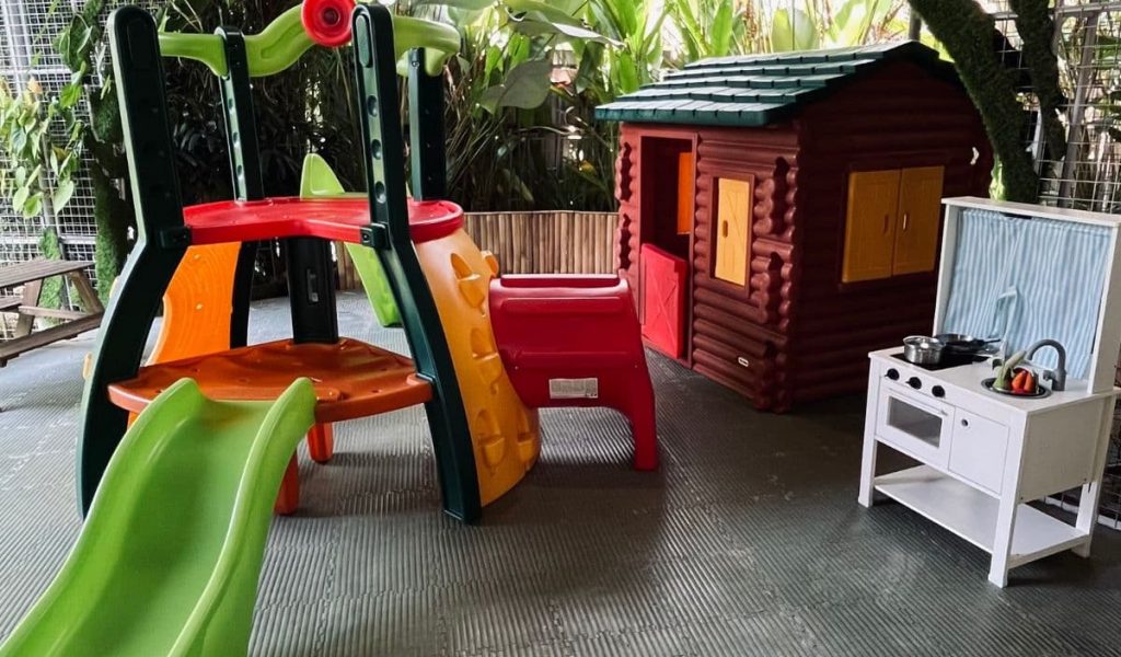 Children enjoying the playground at Dharma Café in Bali.