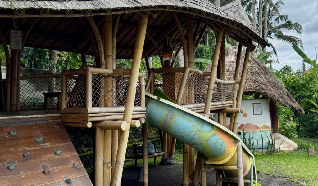 Kids playing in the nature-inspired playground at Mana in Bali.