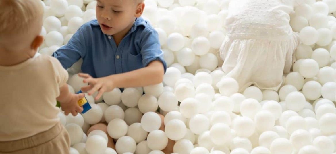 Children playing in the outdoor playground at Tiny Healthy Café in Bali.
