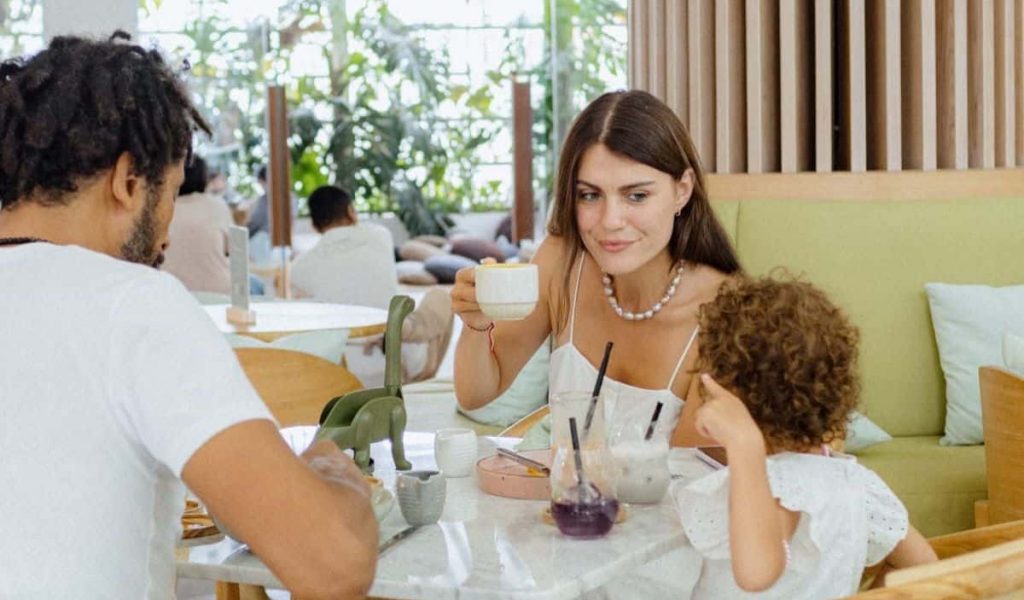Family enjoying a healthy meal together at Tiny Healthy Café in Bali.