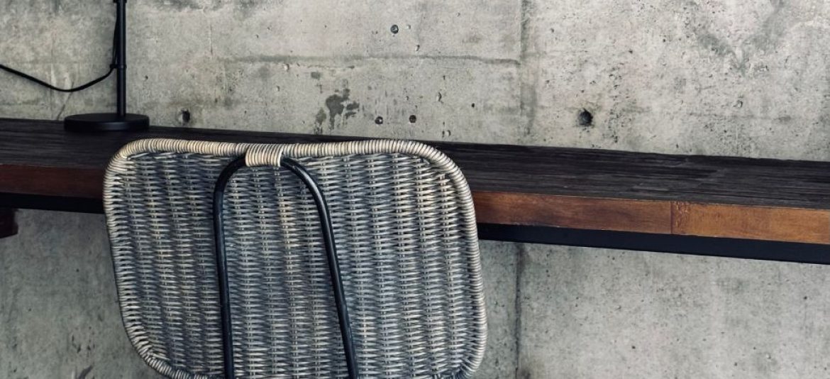 Industrial-style reception desk at Kasia Boutique Hotel in Ungasan featuring raw concrete, clean lines, and minimalist design