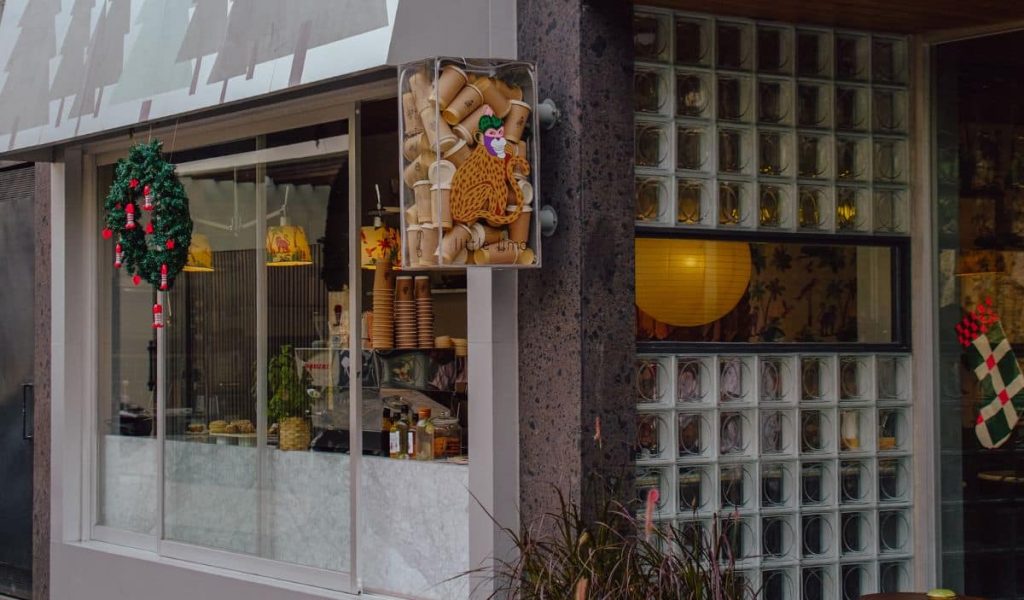 Industrial-style café interior at Little Lima in Pererenan featuring raw concrete, modern design, and minimalist details