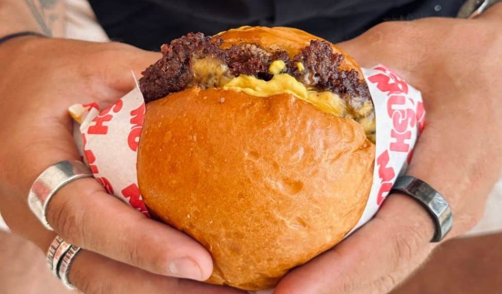 Gourmet burger from Mush Burger with juicy patty, fresh toppings, and homemade bun.