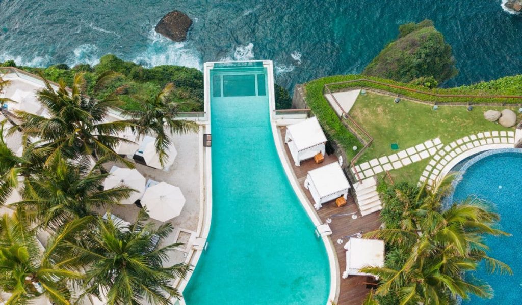Oneeighty Uluwatu glass pool cliff ocean view Bali beach club
