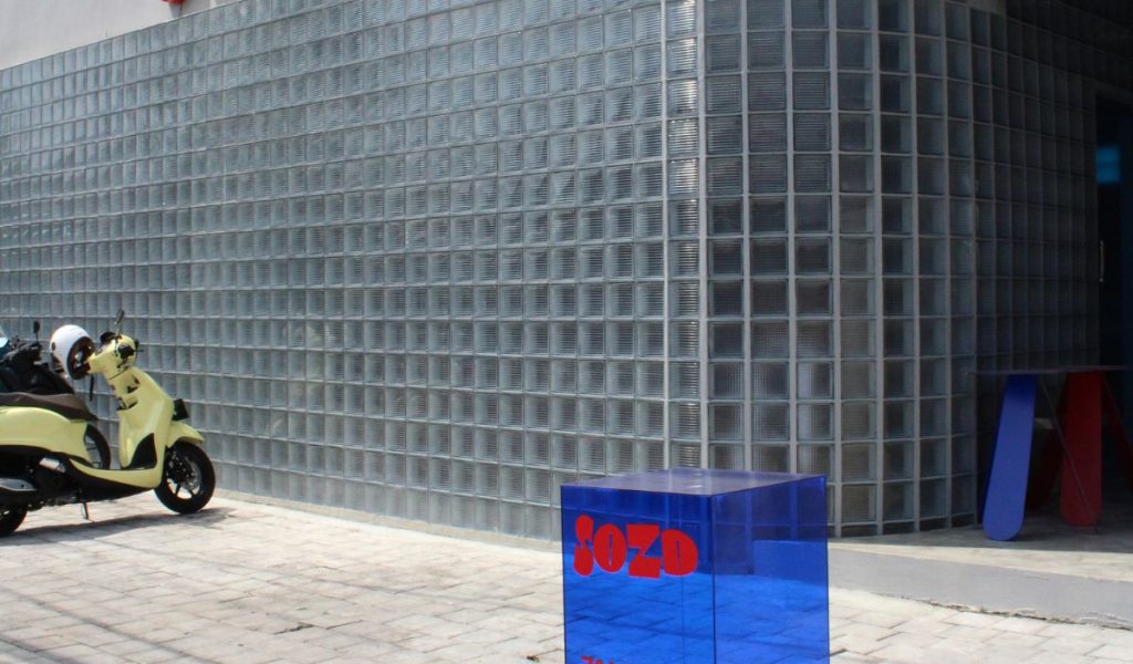 Industrial café exterior at SOZD in Canggu featuring raw concrete façade and minimalist architectural design