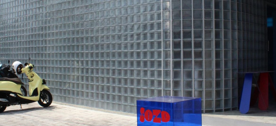 Industrial café exterior at SOZD in Canggu featuring raw concrete façade and minimalist architectural design