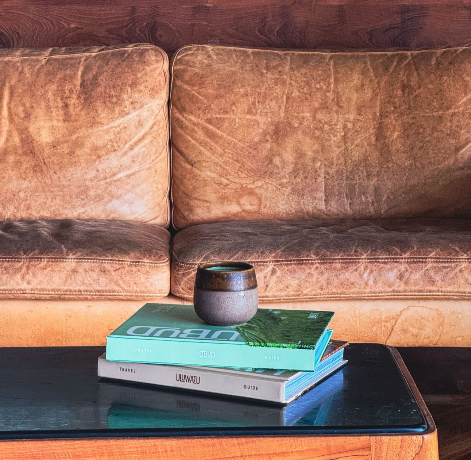 Stay In travel guides stacked on a table, showcasing elegant cover designs